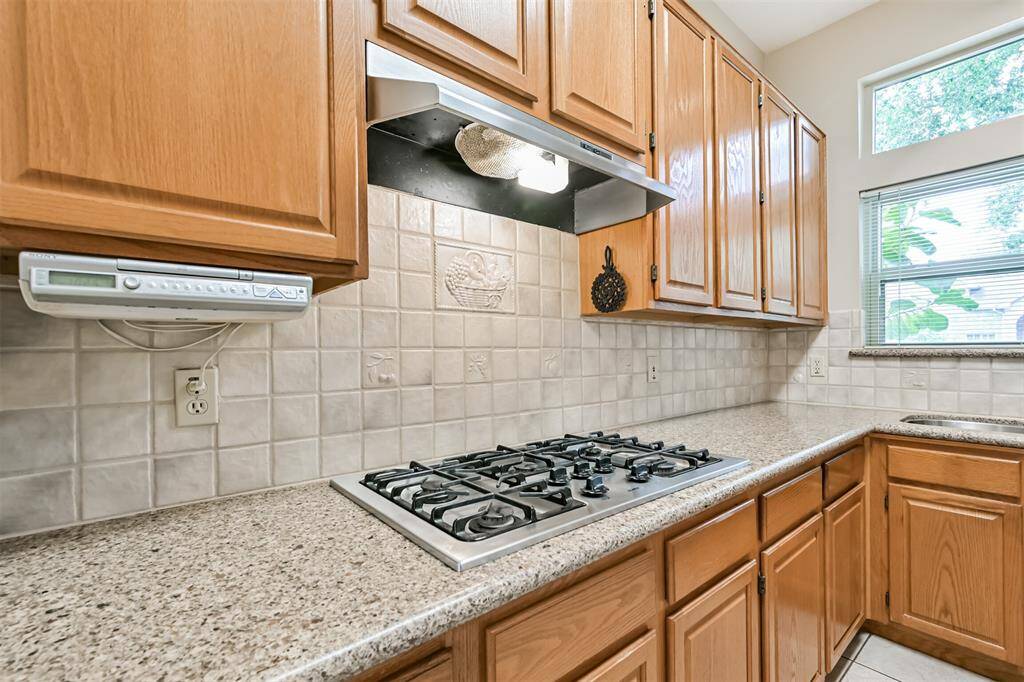 Ample cabinetry offers generous storage for all your kitchen essentials.