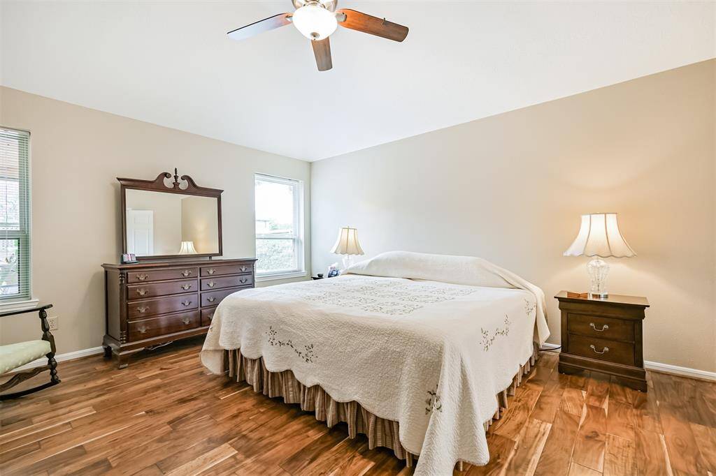 Primary bedroom- Engineered Acacia hardwood floors add style and warmth.