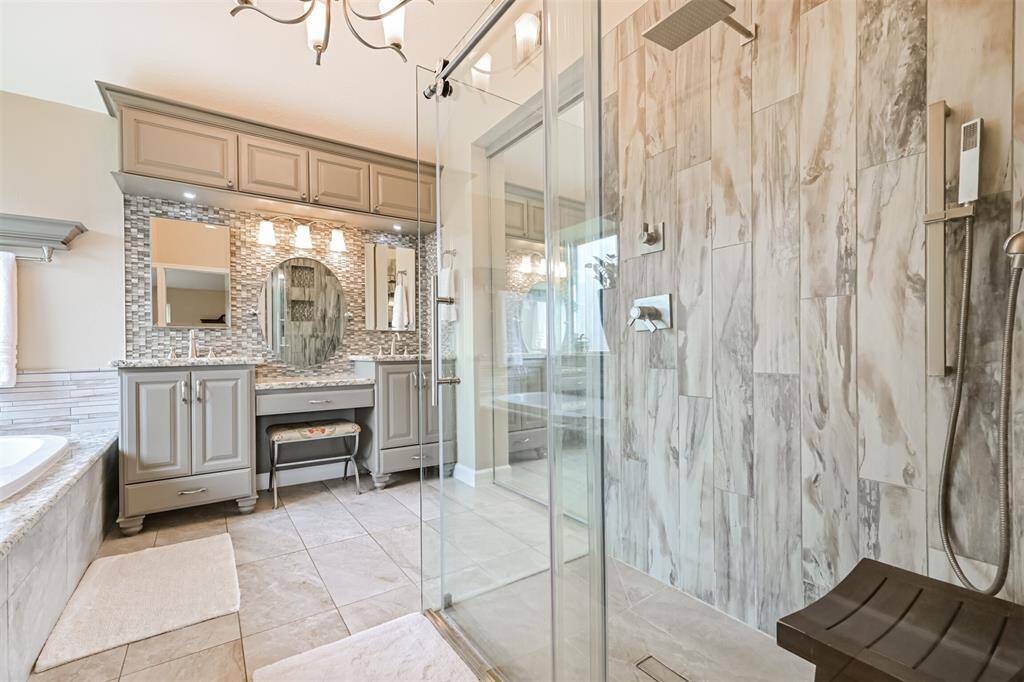 Primary bath offers a spa-like retreat with stunning finishes.