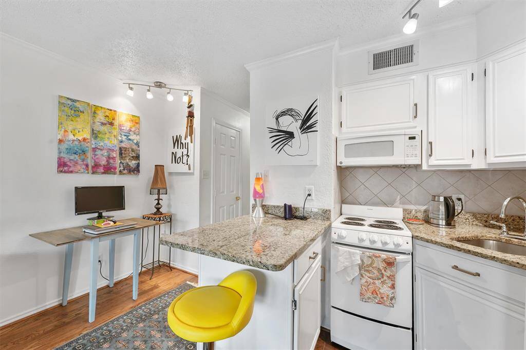granite countertops.  Stove and microwave