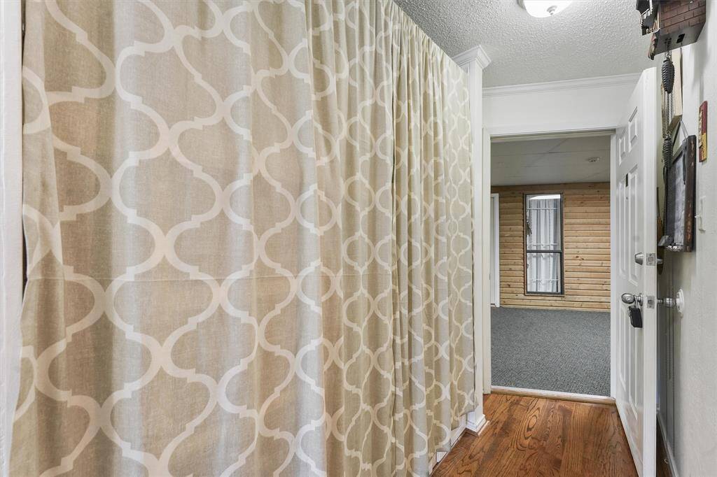Bunkbeds hidden by a curtain.