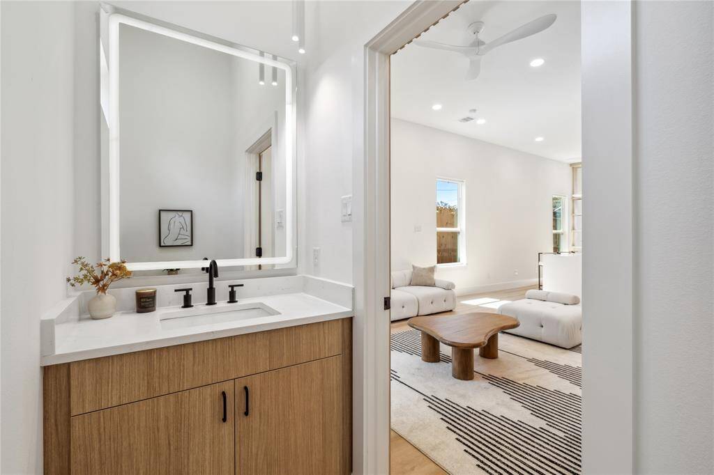 Elegant and efficient, the powder room features contemporary design elements in a small but impactful space.