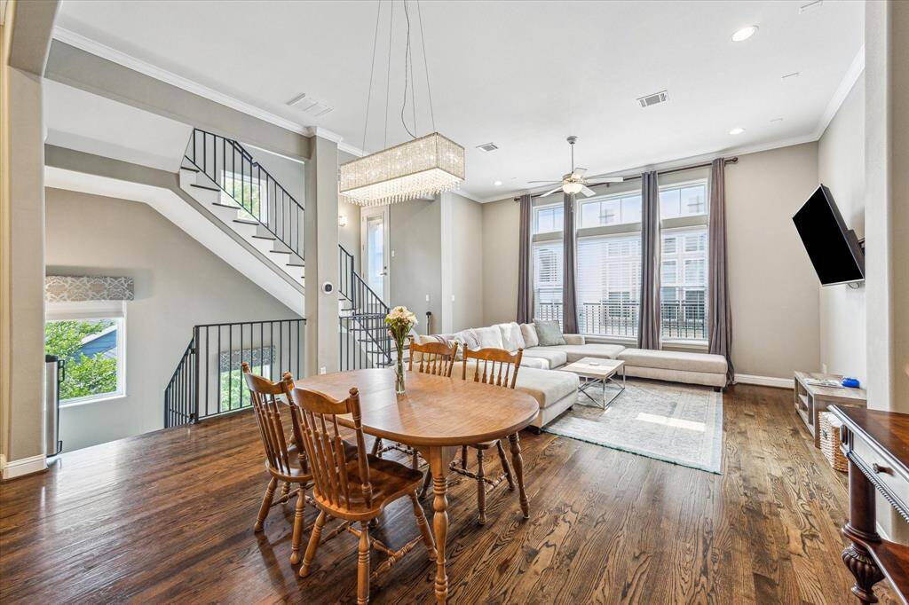 Enjoy a modern-airy vibe and plenty of room to entertain; the dining area anchors the main floor and offers seamless connection to the living area and the kitchen.