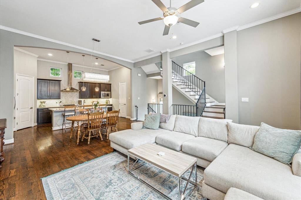 From this cozy vantage point in the family room, you get a full view of the main floor with living, dining, and kitchen all connected in one open, flowing space. Whether you're hosting a dinner party, catching up over coffee, or just enjoying a quiet evening, this layout keeps everything and everyone within easy reach without ever feeling crowded.
