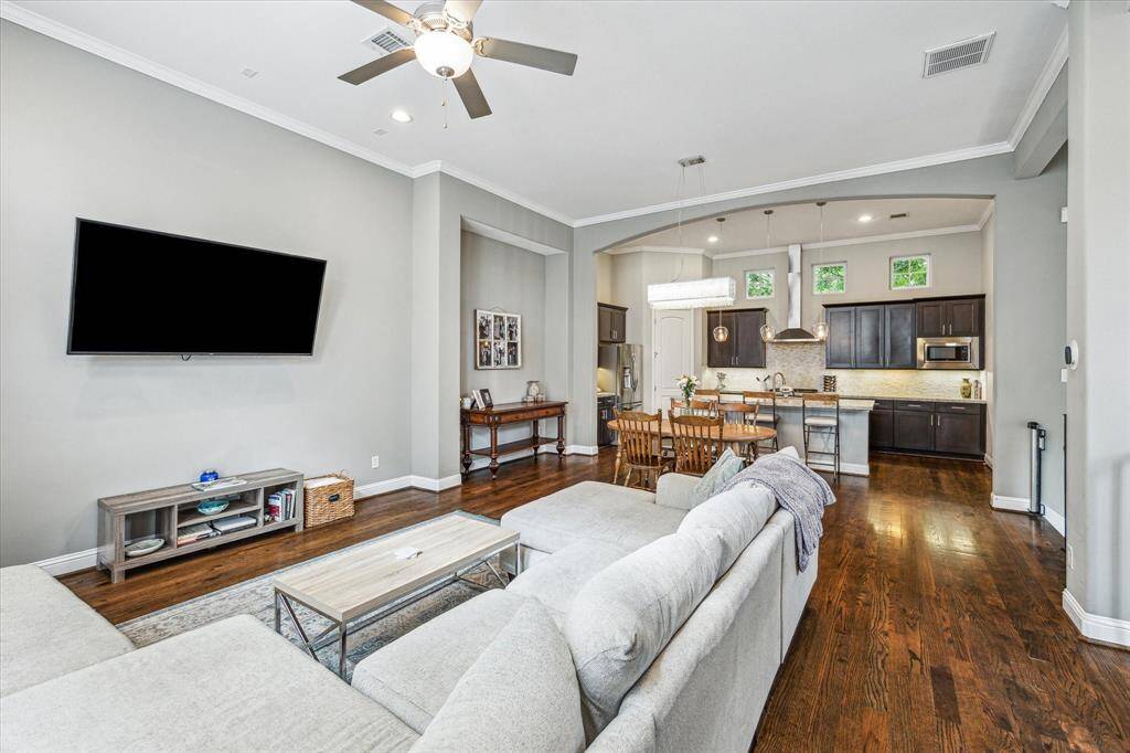 This open-concept family room flows seamlessly into the dining area and kitchen, making it easy to stay connected whether you’re entertaining or just hanging out with your favorite person.