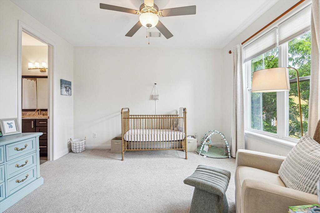 With three private suites, you’ll always have room for family or company. Situated across from the primary, this third-floor retreat features soft neutral finishes, a large closet, and a private ensuite bathroom. This is the perfect setup for visiting guests or a nursery for your little bundle of joy to be nearby.