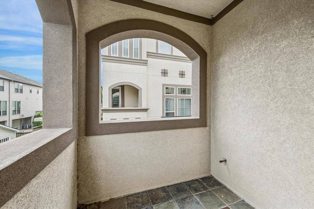 Just off the main floor living and dining areas, this covered balcony offers a quiet spot to enjoy your morning coffee or evening breeze.