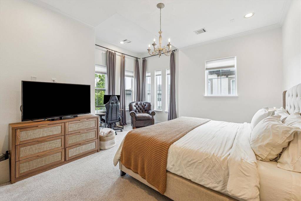 Start and end your day in style in this luxe third-floor retreat, where a window-lined sitting nook captures sweeping views of Houston. Designed for both comfort and function, the suite offers plenty of space to relax and unwind, a large walk-in closet, and a spa-inspired ensuite.