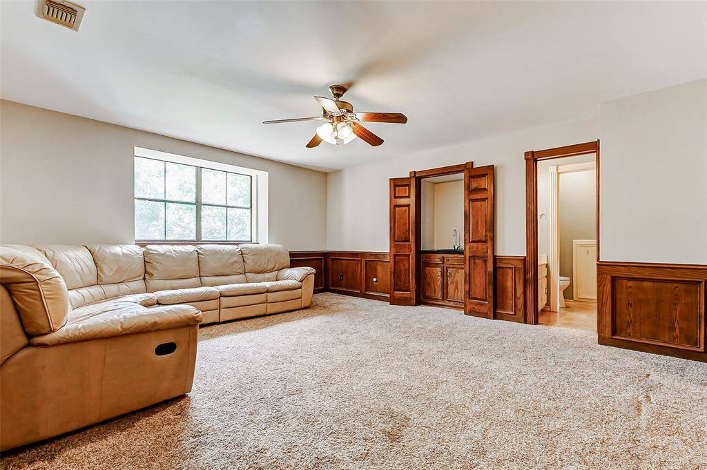 Game room with with wet bar and bathroom
