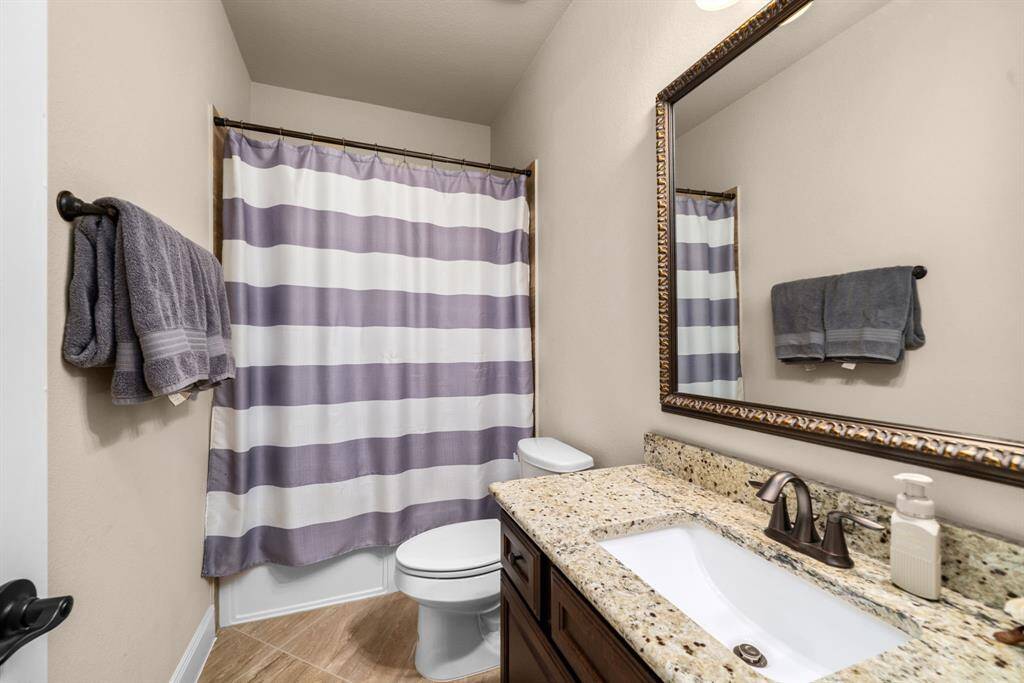 full bath is located in 3rd full bathroom in the front of the home, perfect for guests.