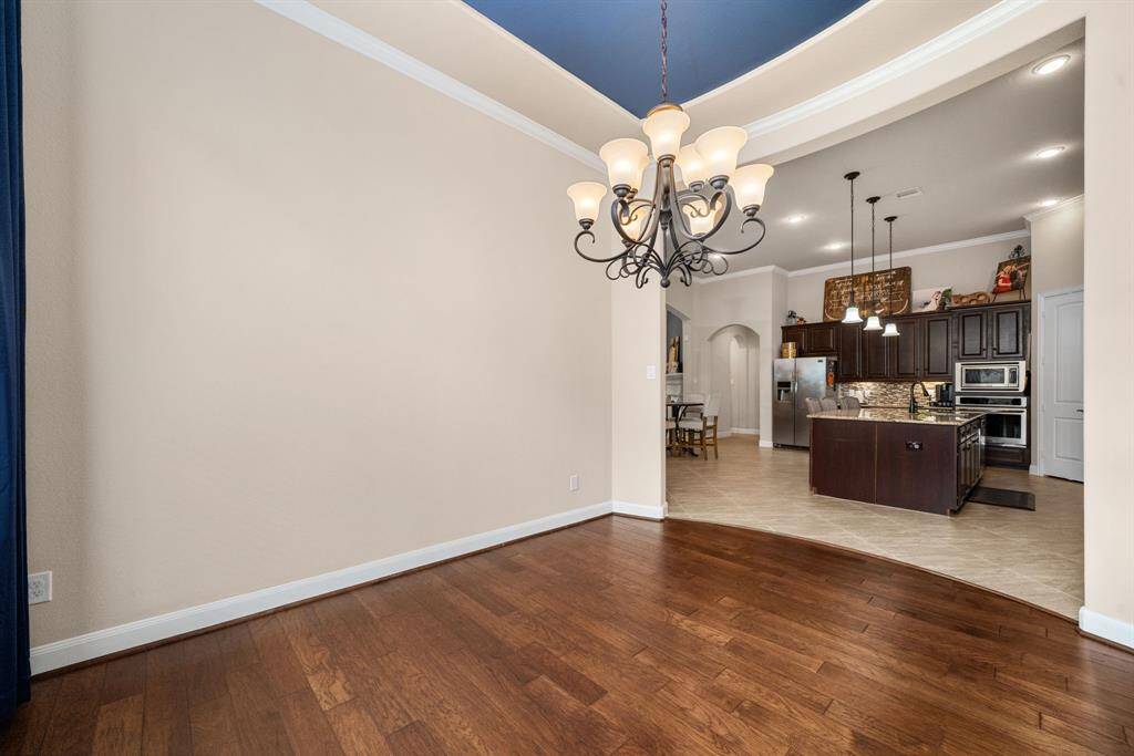 The dining room is open to the kitchen and living room so the conversations are never interrupted. The