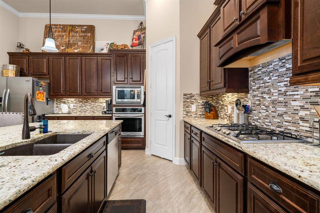 Kitchen has plenty of cabinets and counters for all you prep work and cooking.  Plenty of room for helpers too.