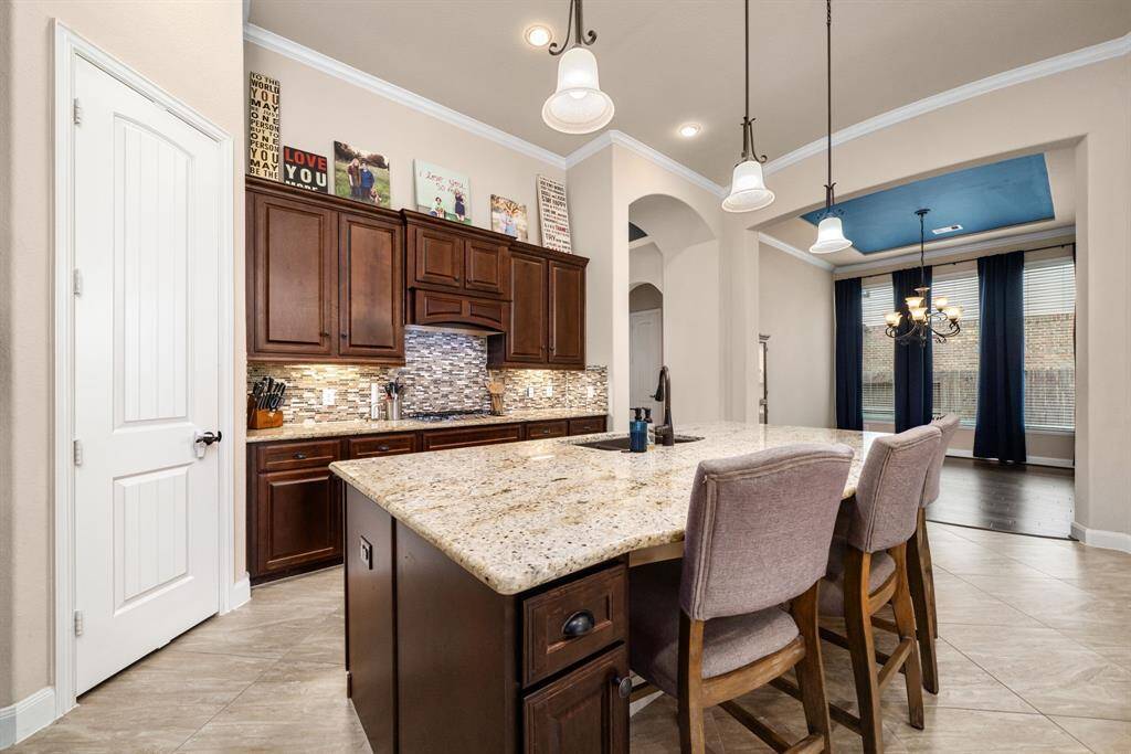 Kitchen has a great flow with a corner pantry, large enough for all your ingredients.