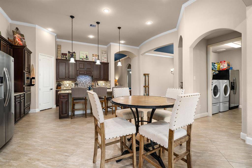 The open floor plan and high ceilings make this home feel even larger than it is.
