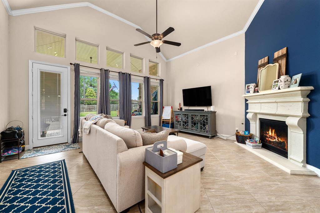 The family room is the heart of the home.  From the fireplace to the backyard view,  this is the place to be.