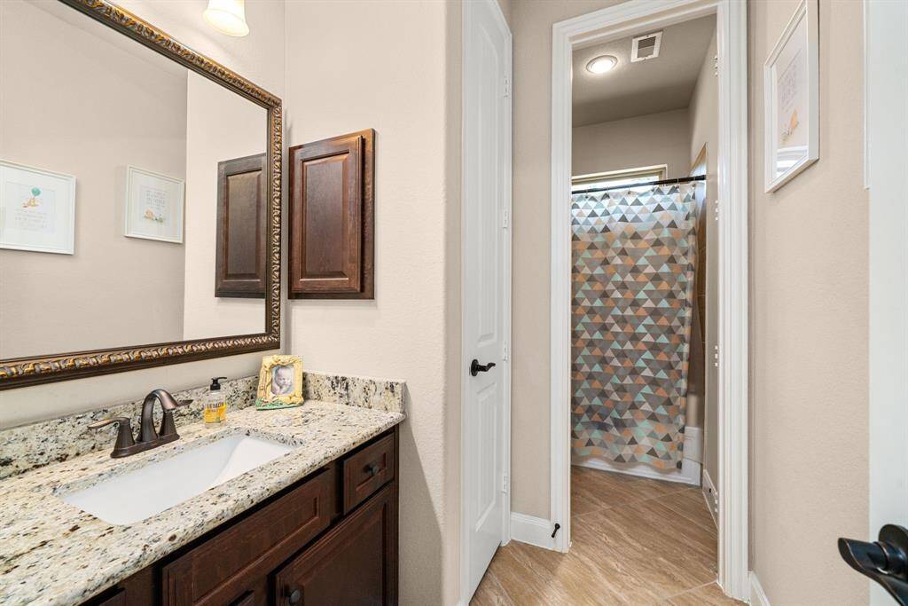 2nd full bathroom separates two of the secondary bedrooms.