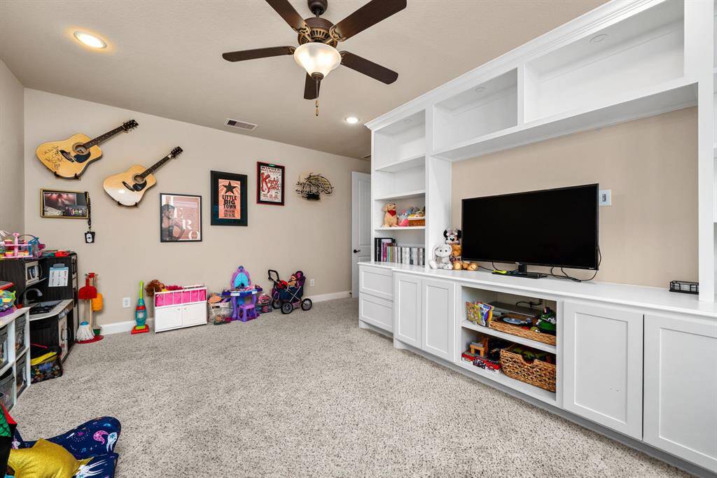 The custom built-ins in the game room are excellent storage, because storage is a theme in this house.