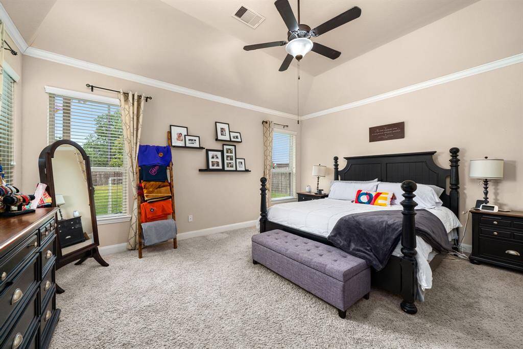Primary bedroom is tucked into the back of this amazing home, it provides plenty of room for peace and quiet.