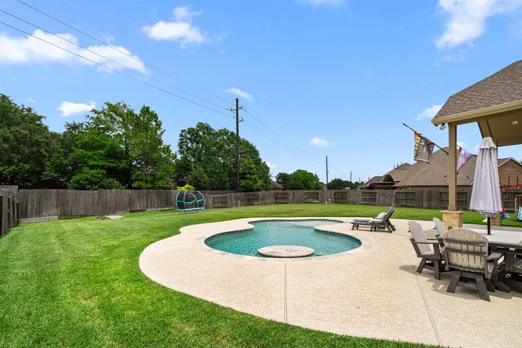 This backyard is built for entertaining.  The pool, the deck, the patio!!!