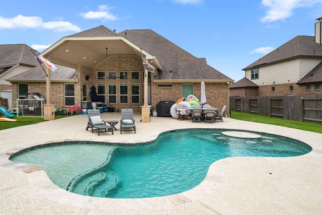This pool has it all!  The tanning ledge, the in water seating area and the huge deck for sunning.