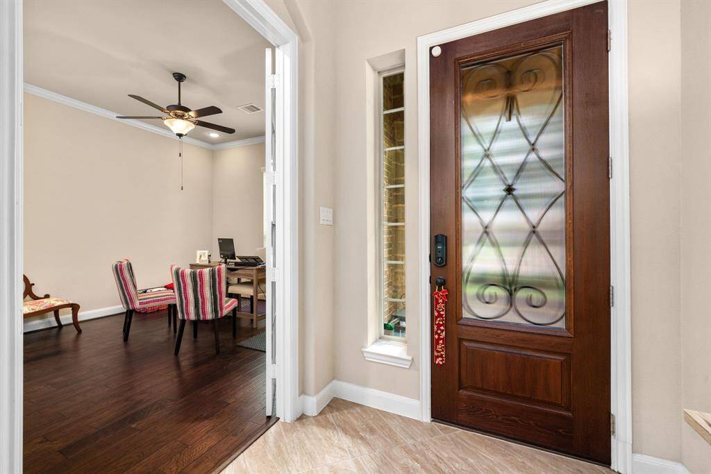 Open foyer is light and bright and gives a great view through the home and to the pool.