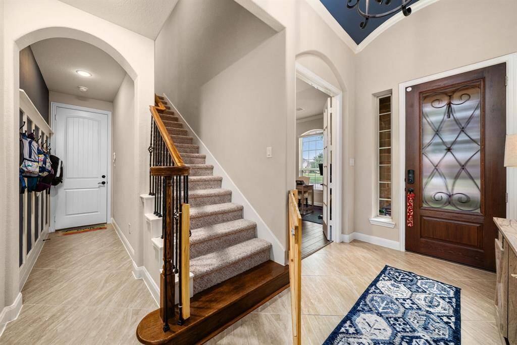 Stairway leads to the large 5th bedroom with full bath and to the enormous floor storage room (Texas Basement)