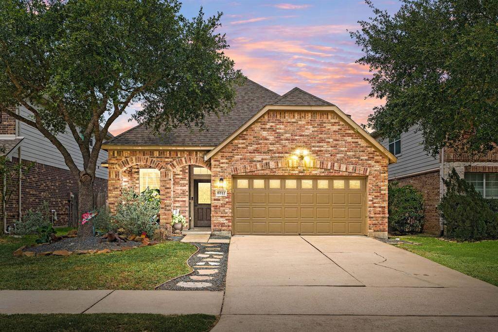 Welcome home to 6311 Guilford Geln located on a quiet street in CincoRanch Southwest and zoned to Katy ISD! This stunning home has lovely curb appeal, a well-manicured lawn, beautiful landscaping, dark stained front door with glass detailing, covered front porch, traditional style, dark stained shutters, beautiful outdoor lanterns and a double wide driveway!