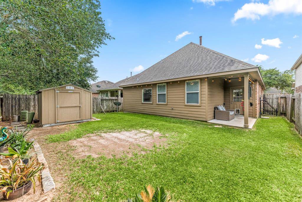 Fully fenced yard with mature trees and endless green space, ideal for pets, gardening, or adding a future pool.