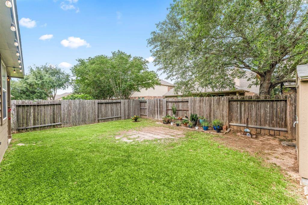This backyard invites your vision, add a pool, build raised gardens, or simply let kids and pets run free.