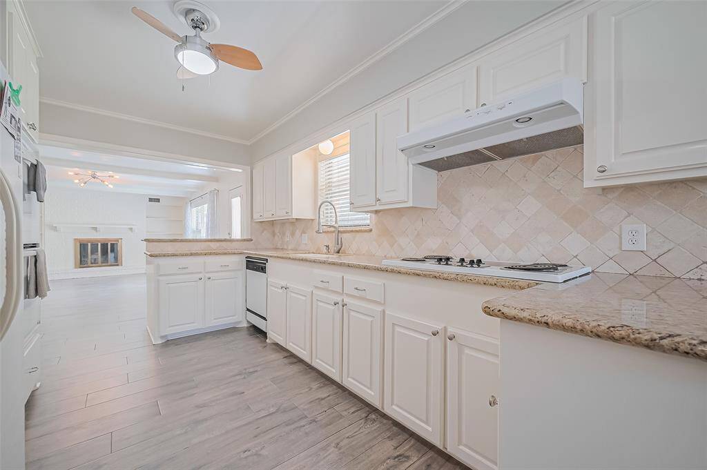 View of the kitchen, which opens up to the family room
