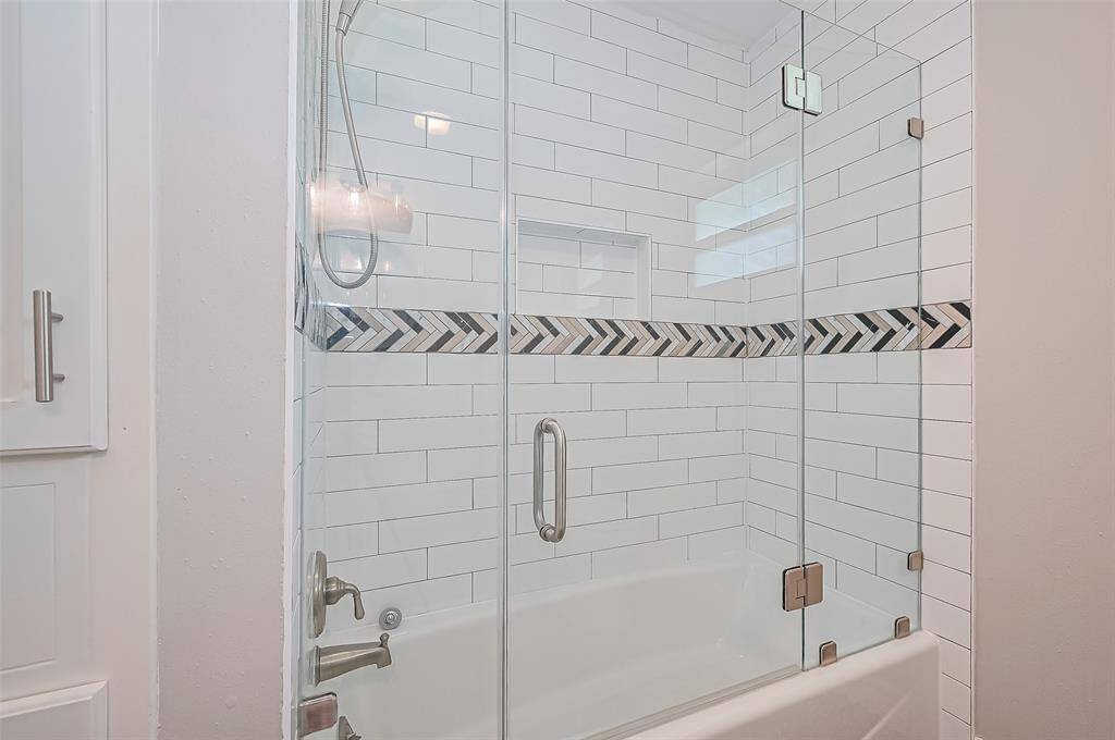 View of the shower in the secondary bathroom.