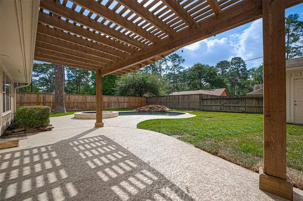 Additional view of the covered patio looking out over the yard.