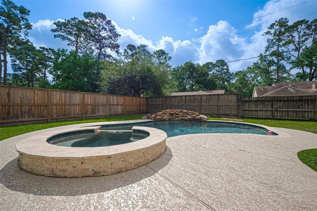 Additional view of the hot tub and pool.