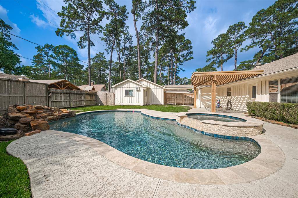 Additional view of the pool and backyard.