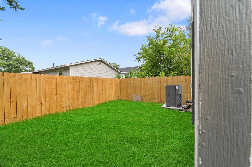 Backyard with new fencing and green space