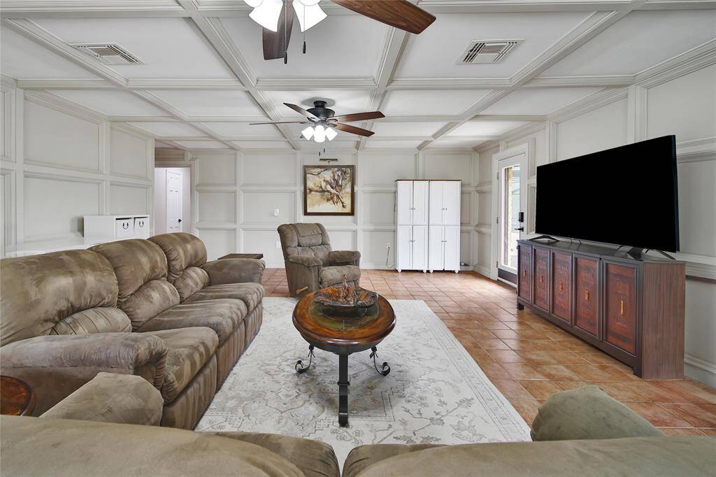 The Family Room is a perfect example of spaciousness throughout the home.  Exterior door leads to the back of the property.