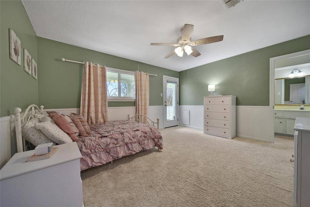 Each of the three  upstairs bedrooms are generously sized and has ceiling fans and walk in closets. This bedroom boasts and ensuite bathroom. New carpet was installed on the stairs, upstairs hallway and all 3 bedrooms in March 2025.