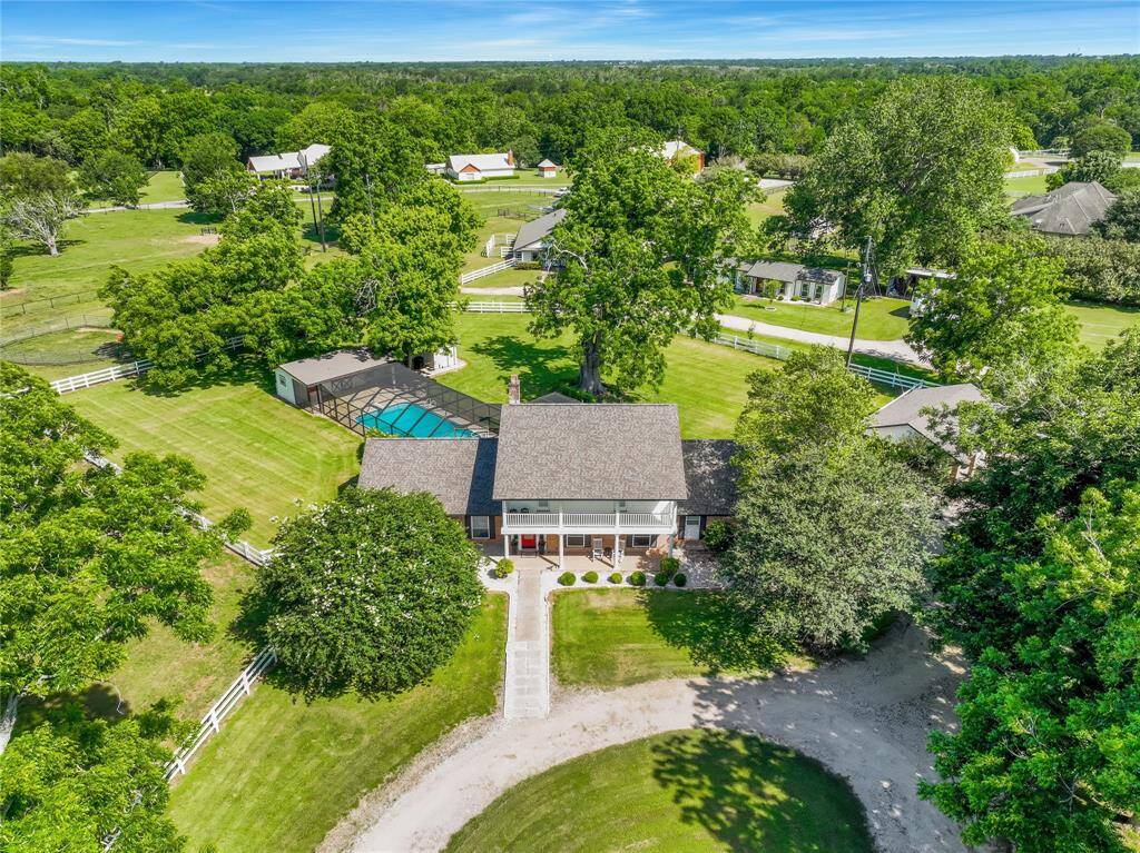 Sitting on an impeccably expansive 5.9+ acres, this 4 bedroom, 3.5 bath luxury home perfectly encapsulates modern Texas living. Pecan and Oak trees frame this 4,100 sf farmhouse that draws in many elements to create the ideal dream home. In 2022, the current owners replaced the shingles, all windows, doors to home as well as had the exterior and interior repainted eliminating a lot of deferred maintenance.