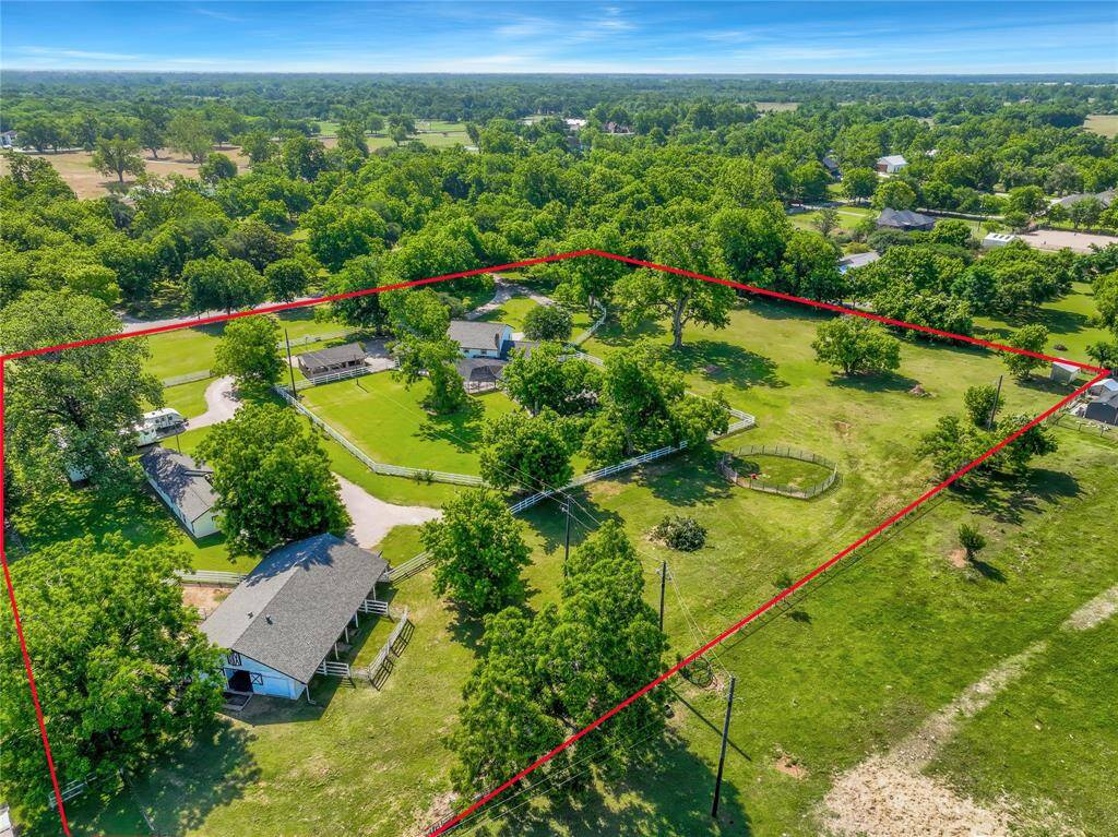 The home sits on a property that is so large that the possibilities are endless in terms of what you can do with it. The white fencing surrounding parts of the property are perfect for animals to freely graze, whether they are family pets pr horses.