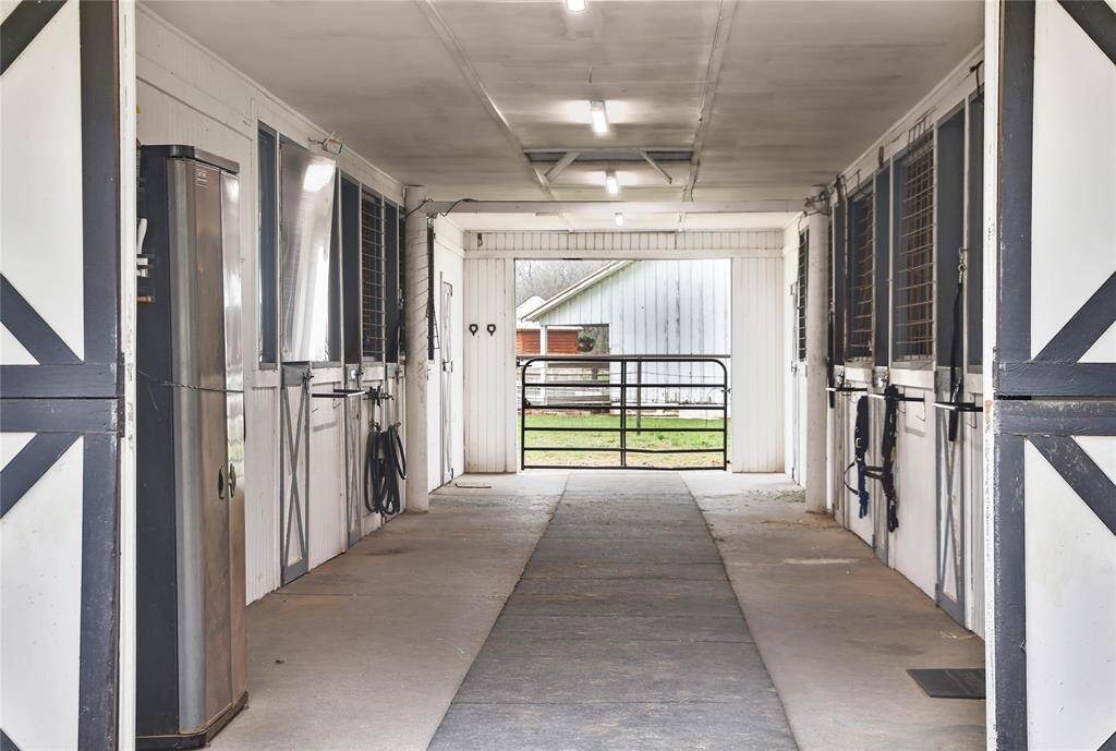 The barn is expertly situated to enable the optimal airflow and the accompanying attic fan and stall fan hookups will keep your horses comfortable on even the hottest Houston days