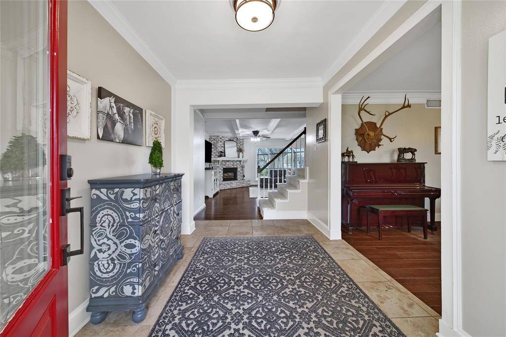 Welcome Home! One step inside the front door and you immediately feel the home's farmhouse infuence with the wood beam ceilings and original wood and peg flooring.