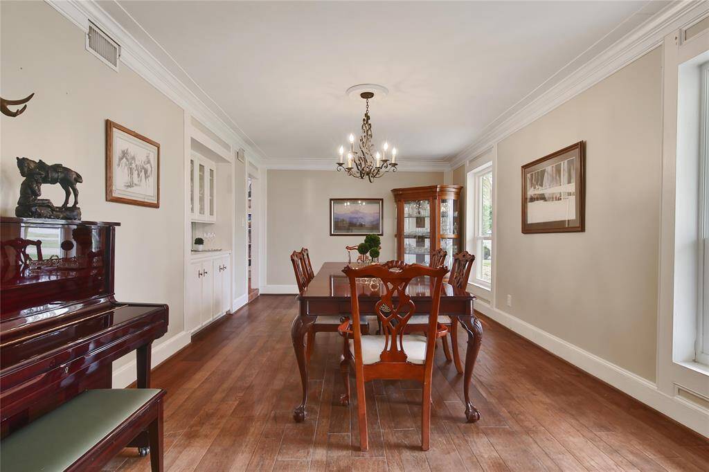 Elegant, Stately and very spacious - three words that easily describe the Dining Room. Wood floors, crown molding and a built in Butler's Pantry  provide that perfect setting. Whether its Thanksgiving dinner with your family and friends or just a special occasion, the Dining Room is capable of making any meal special.