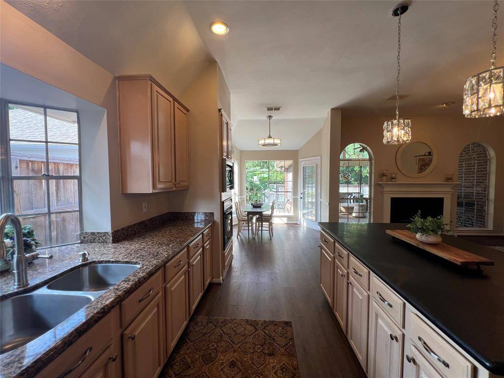 Bright breakfast room with great view of backyard and sunroom.