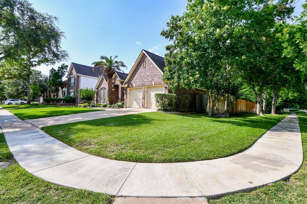 Beautiful primary bathroom with large tub, double sinks, & newly redone stand alone shower.