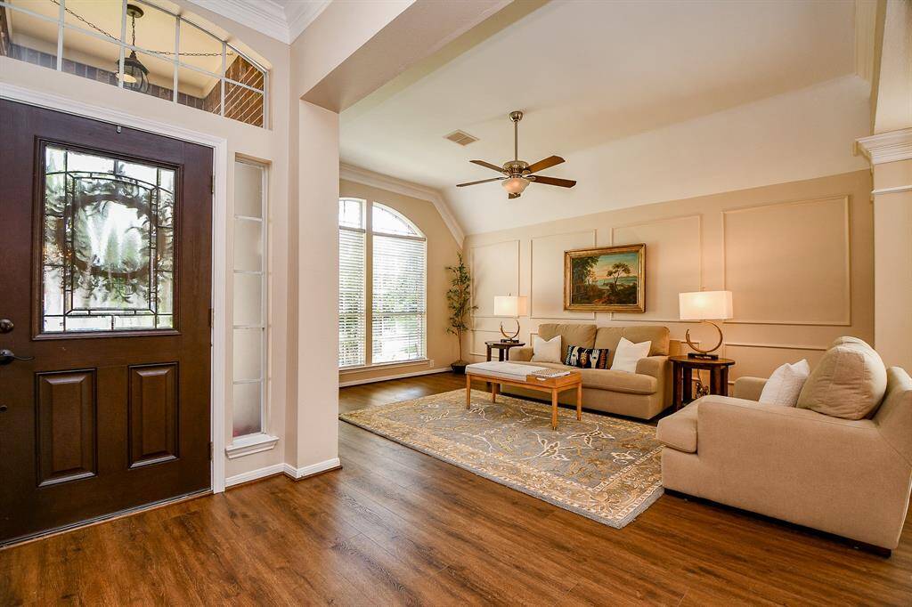 Love this space!!! Brick accents, tiled floors, vaulted ceiling, ceiling fan all with amazing views!