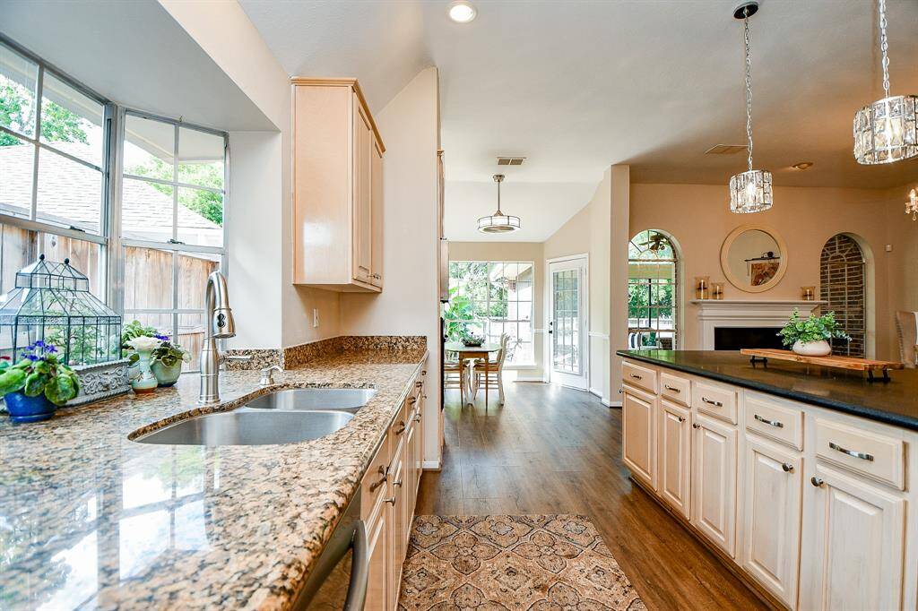 Great side view of green space and wooded area behind home.