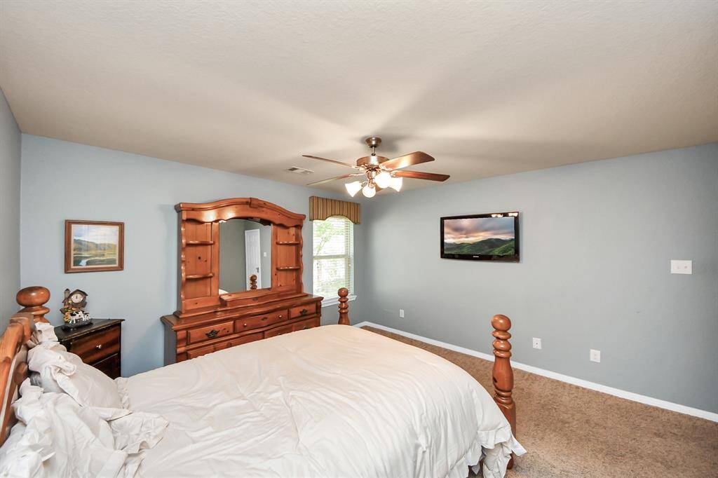 Another view of the spacious secondary bedroom. TVs throughout home stay!