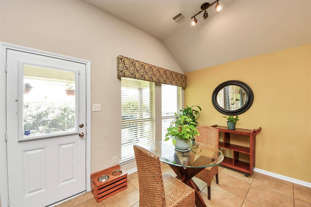 Bright breakfast nook with backyard views.