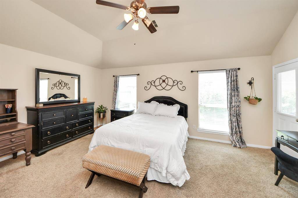 Primary bedroom offers a serene retreat with generous space.