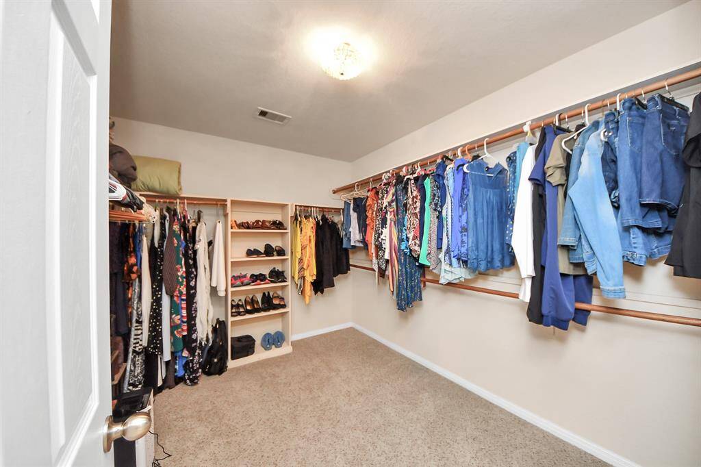Spacious primary closet.